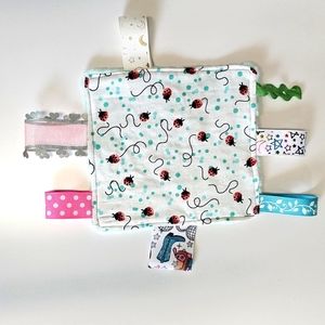 Baby sensory toy with tags